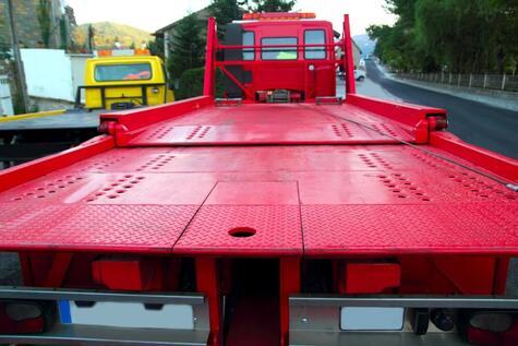 view from the back of tow truck Ipswich's a red tow truck with an empty tray